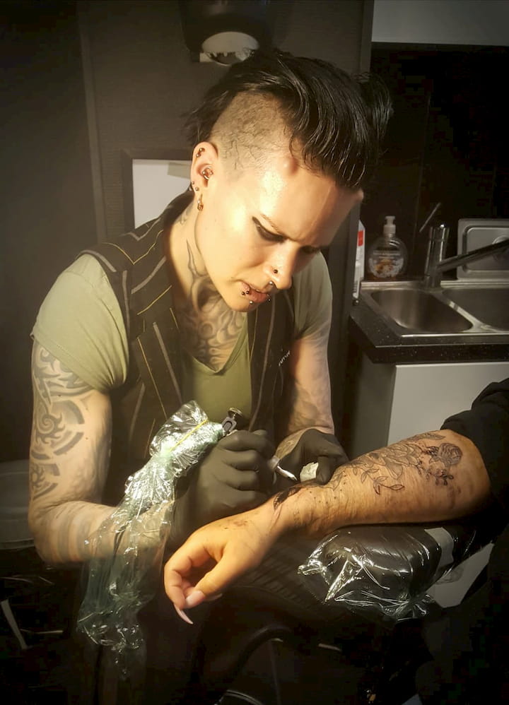 A customer getting a tattoo by Liz