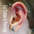 An industrial piercing in a girl's ear
