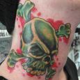 A green skull with a red background