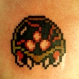 A pixelated metroid prime game tattoo on his chest