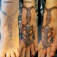An old tattoo on the foot being covered by an anchor