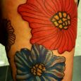 Large vintage flower in red on the thigh