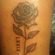 A rose with roman numerals on the side