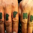 Green norse runes on the fingers