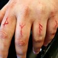 Scarification of runes on the fingers