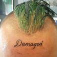 Damaged - tattooed on the forehead