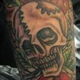 A skull in a new school style with a rose