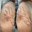 Line tattoo of whales