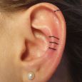 A minimalistic tattoo on the ear
