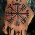 Vegvisir and runes on hand and fingers