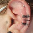 Black simple patterns on the ear.
